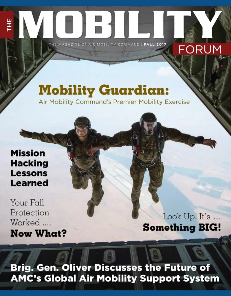 A magazine cover with two men in the air.