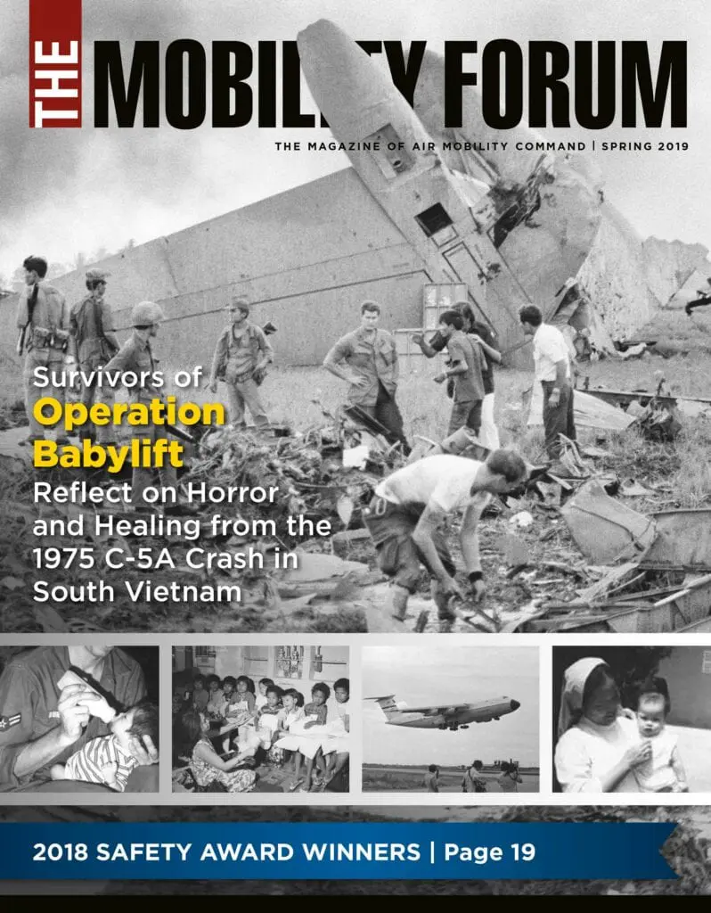 A magazine cover with an image of people working on airplanes.