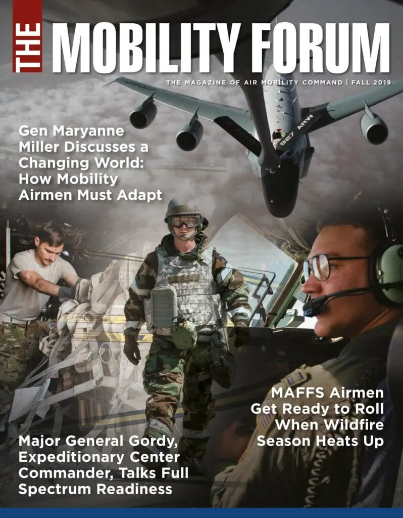 A magazine cover with military personnel in the background.