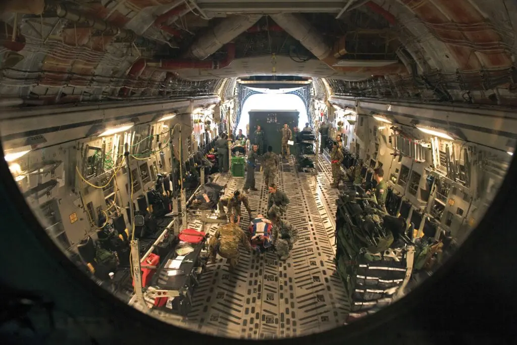 A group of people inside of an airplane.