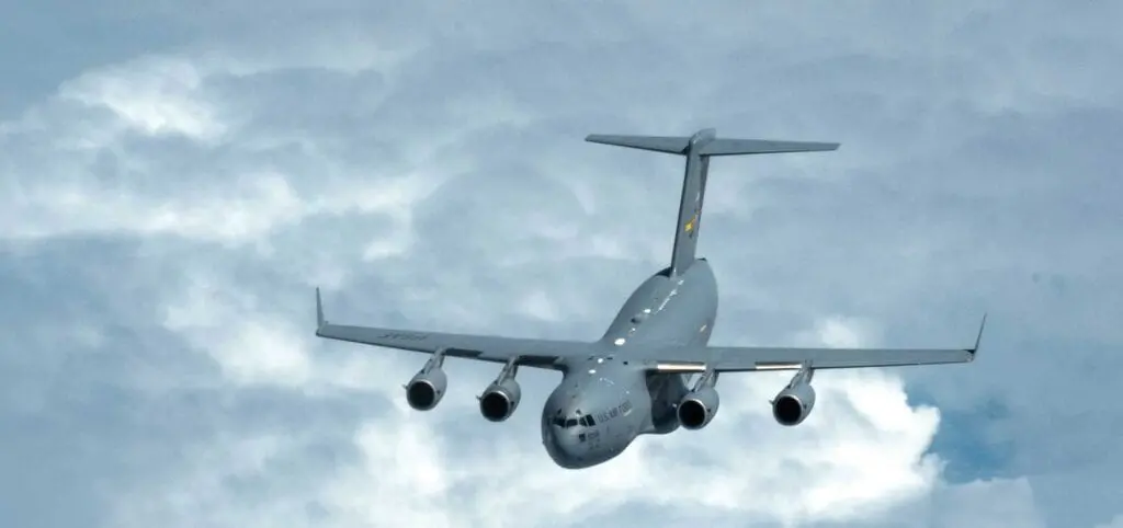 A large airplane flying through the sky