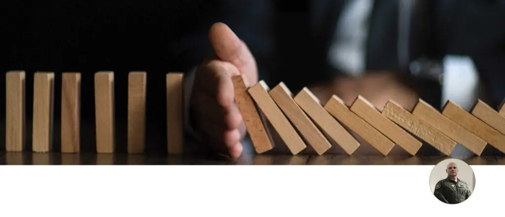 A hand is holding onto some blocks