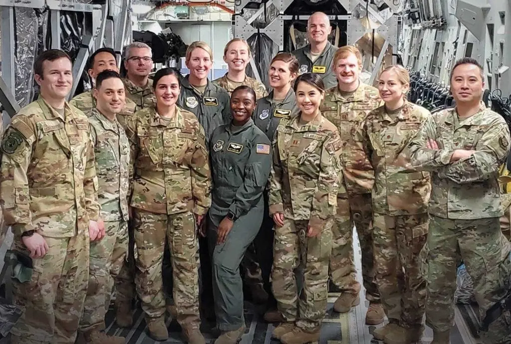 A group of people in uniform posing for a picture.
