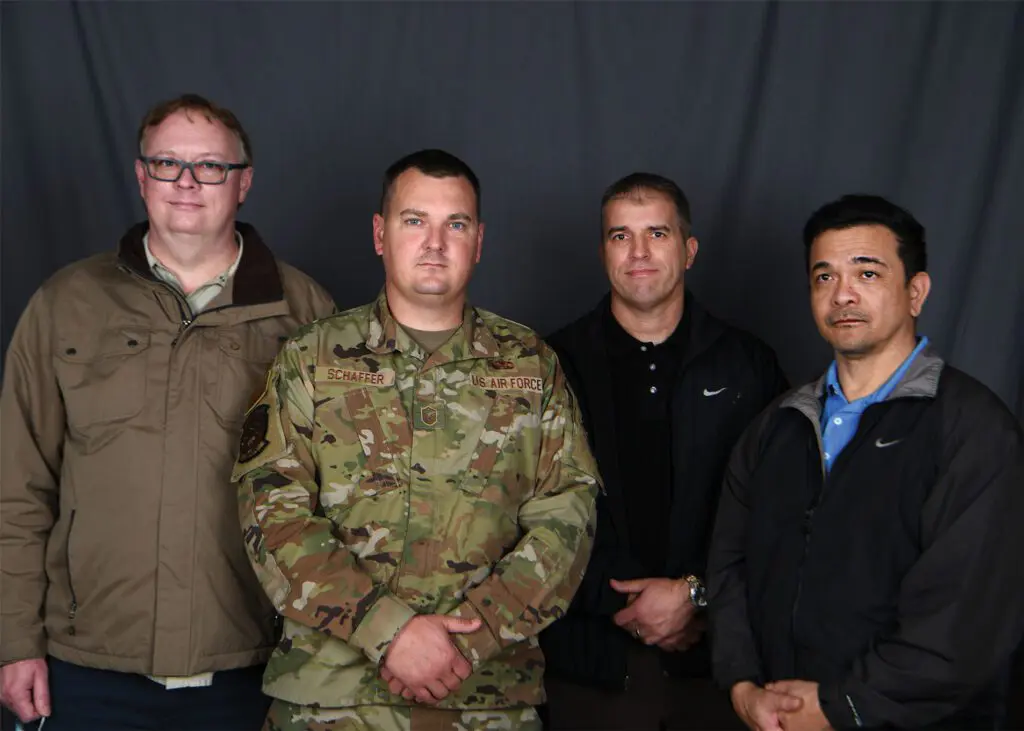 A group of men standing next to each other.