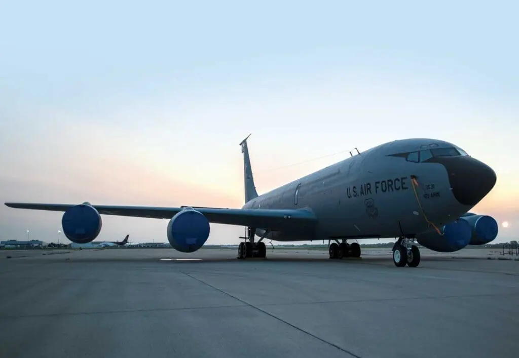 A large air force plane sitting on top of an airport runway.