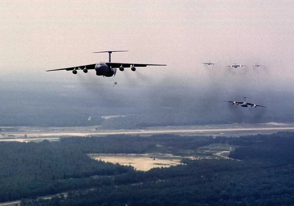 A group of planes flying in the sky.