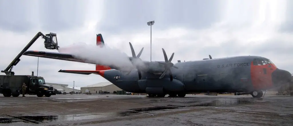 A large airplane with propellers on the side of it.