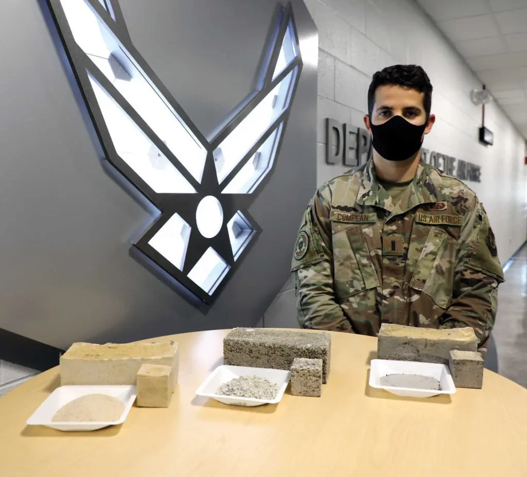 A man in military uniform sitting at a table.