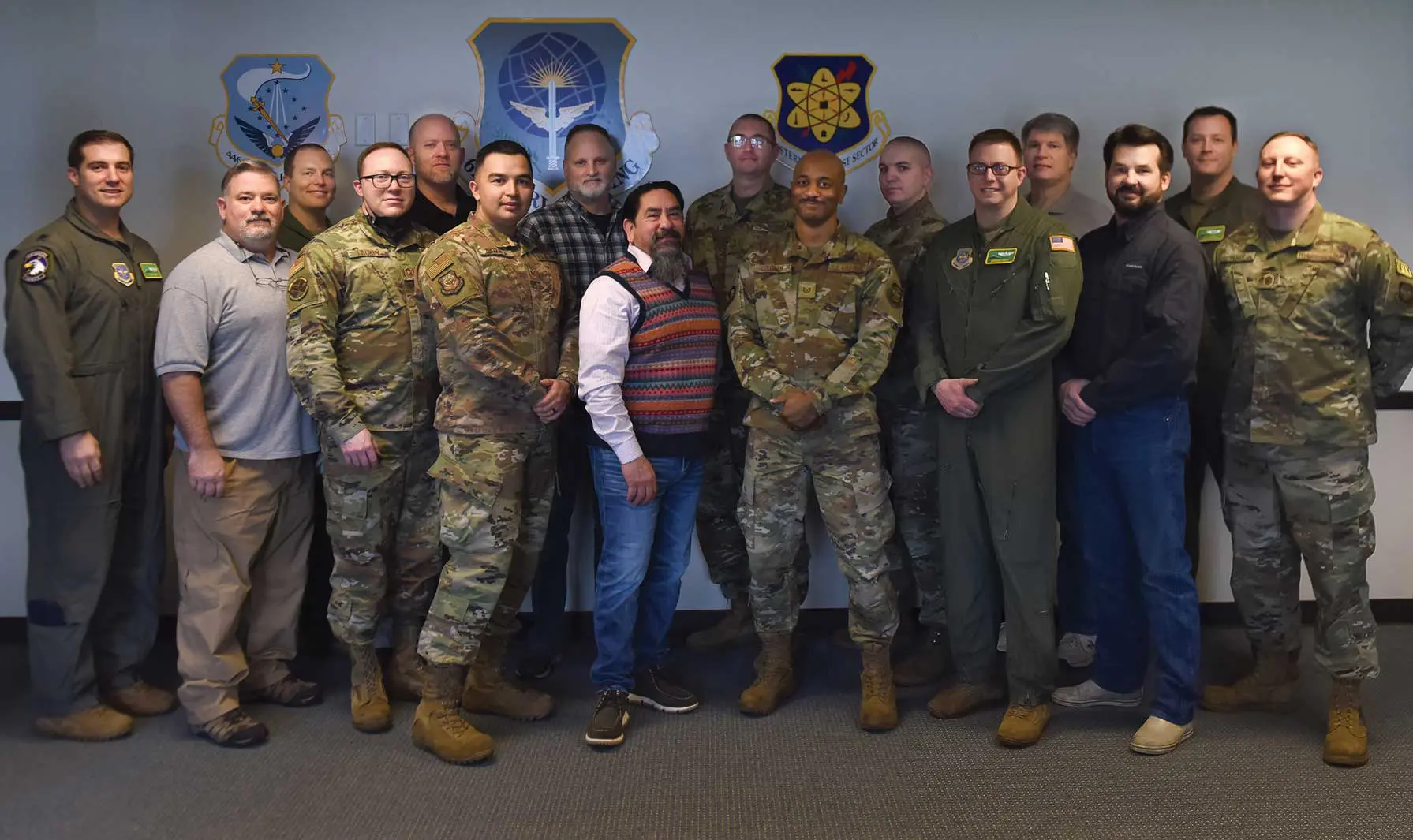 A group of men in military uniforms posing for a picture.