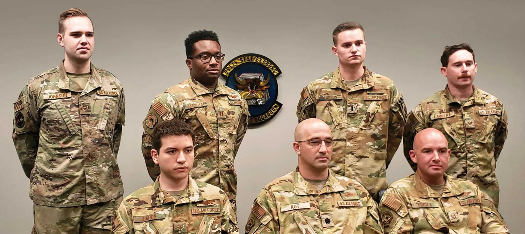 A group of men in uniform posing for the camera.