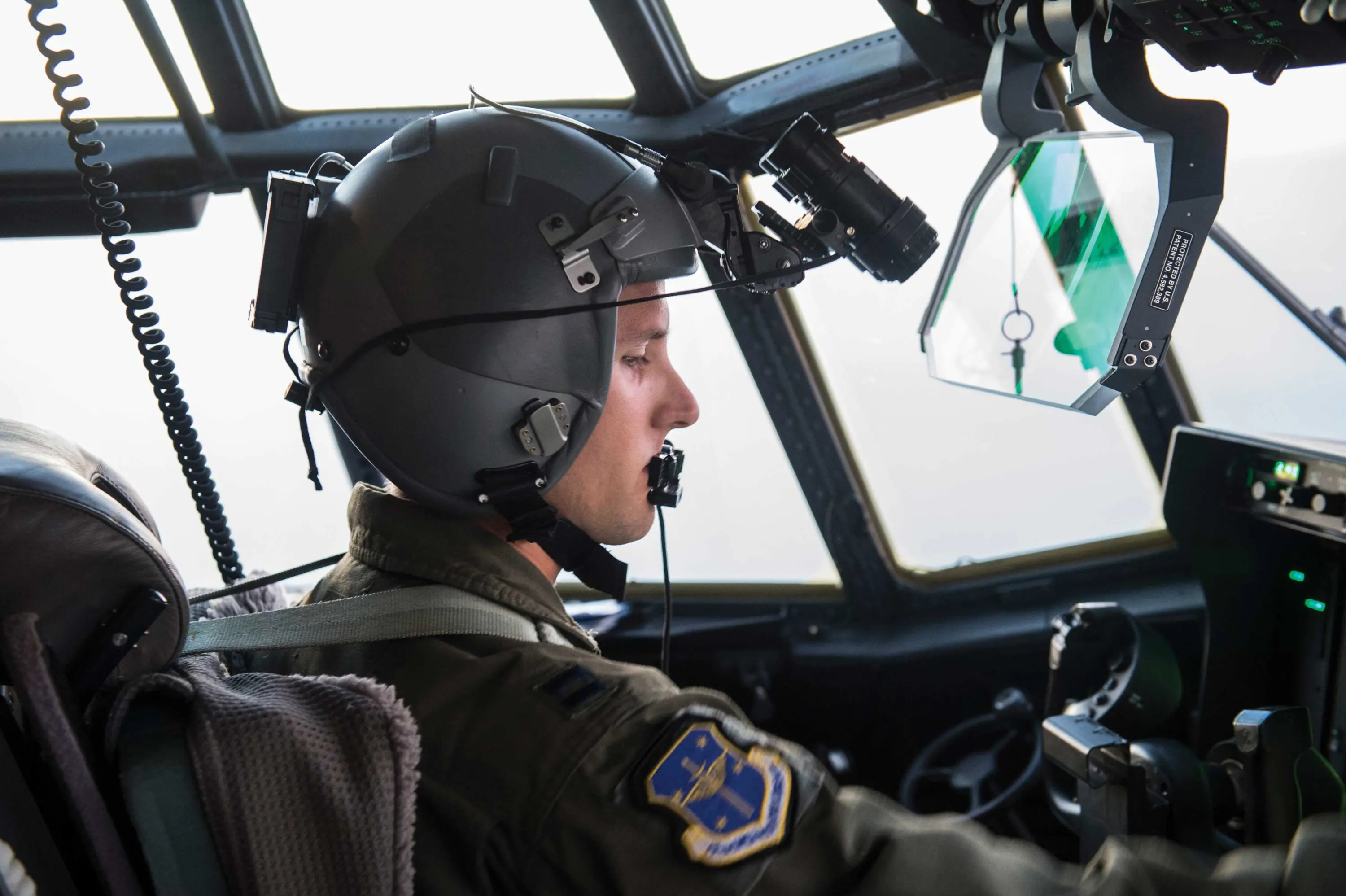A pilot in the cockpit of an airplane.