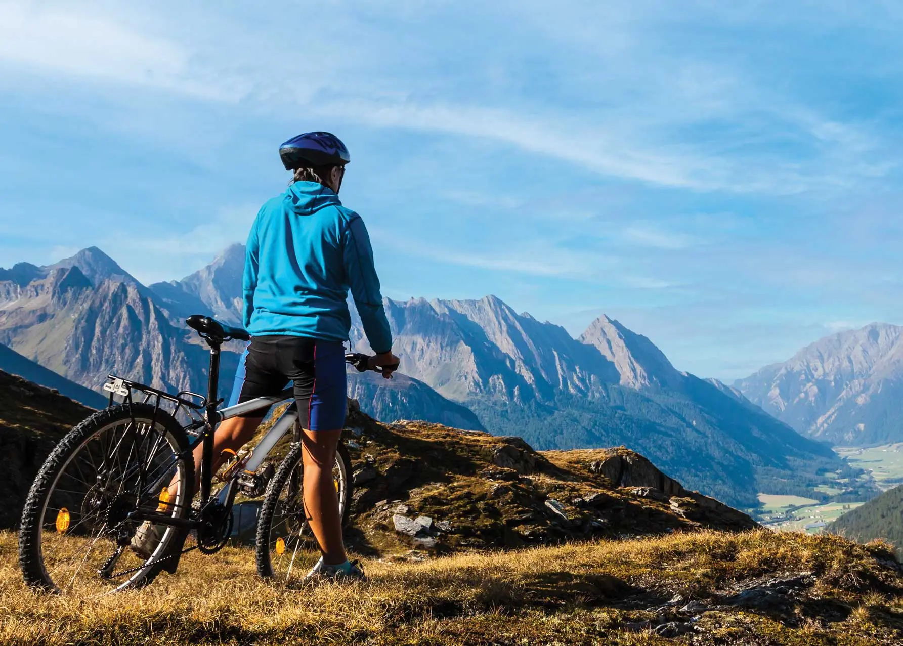 A person on a bike in the mountains