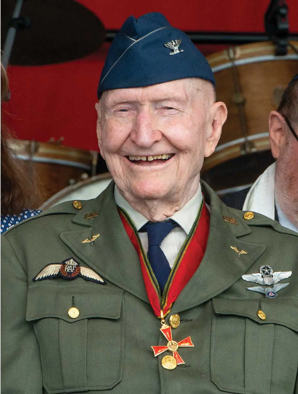 A man in military uniform smiling for the camera.