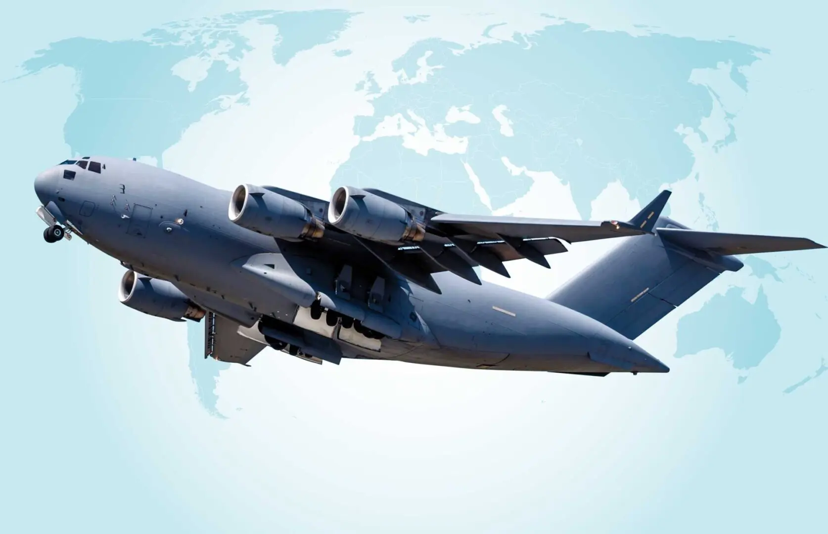 A large jet flying in the sky over a map.