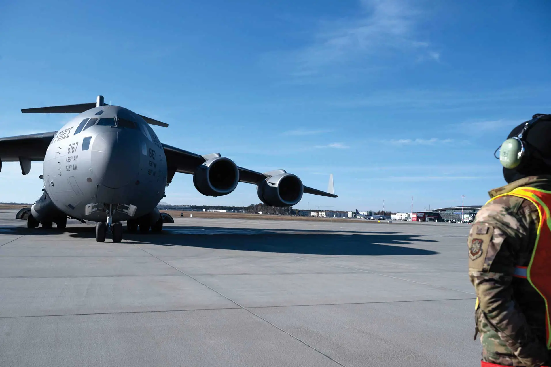 A large airplane sitting on top of an airport runway.