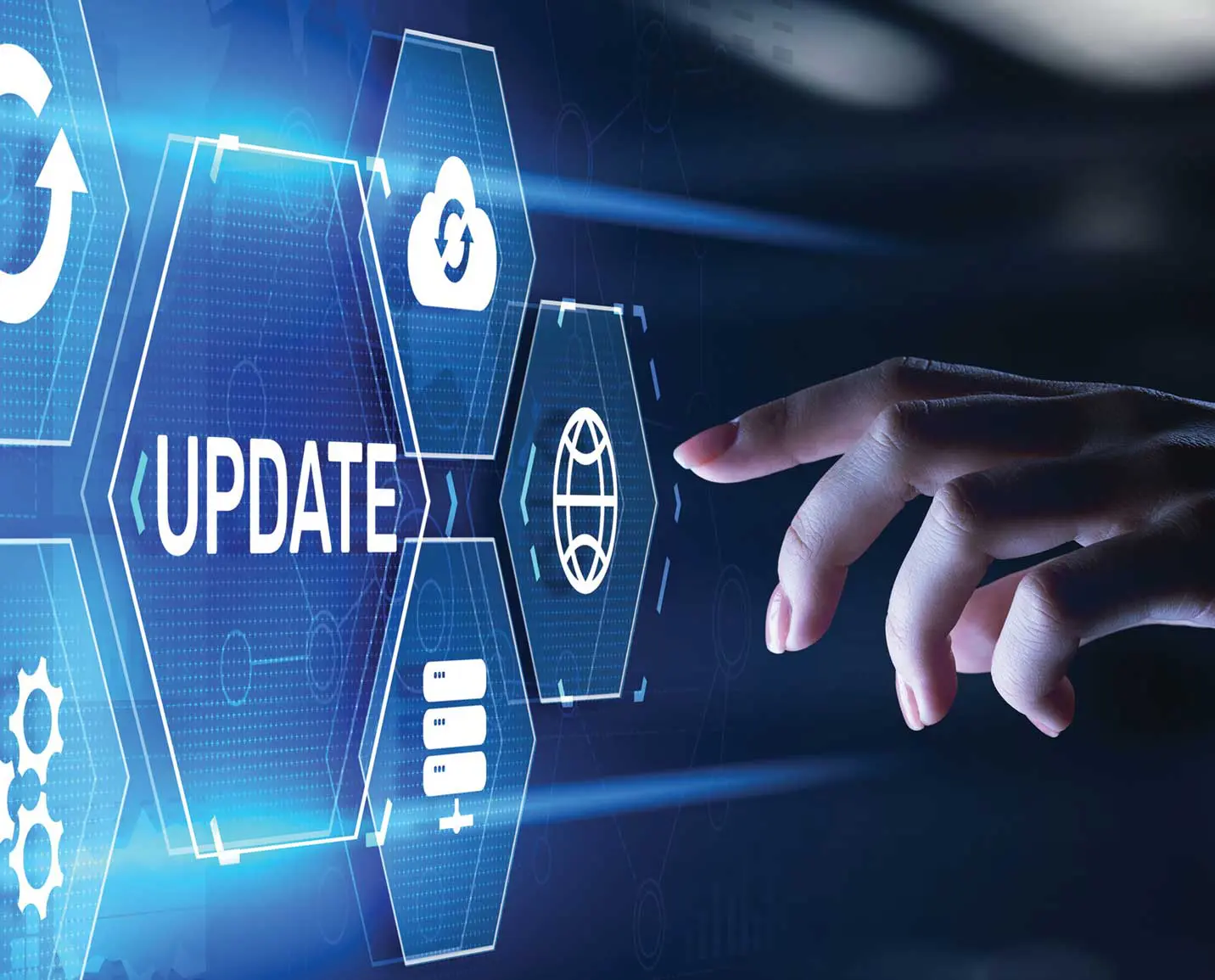 A hand touching an update button on a screen.