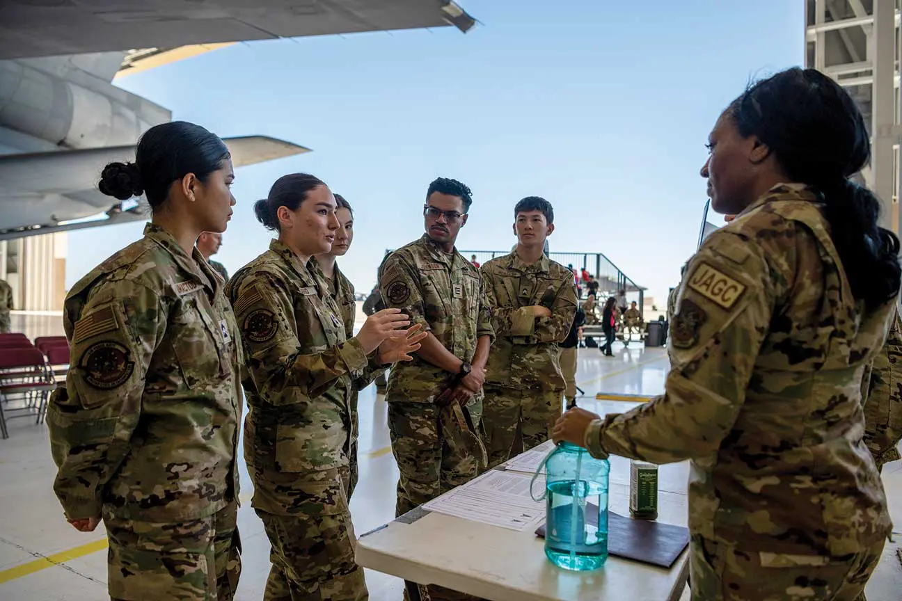 A group of soldiers standing around a table.