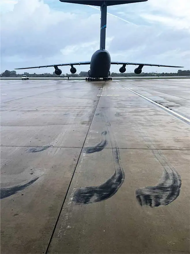 A large jet sitting on top of an airport runway.