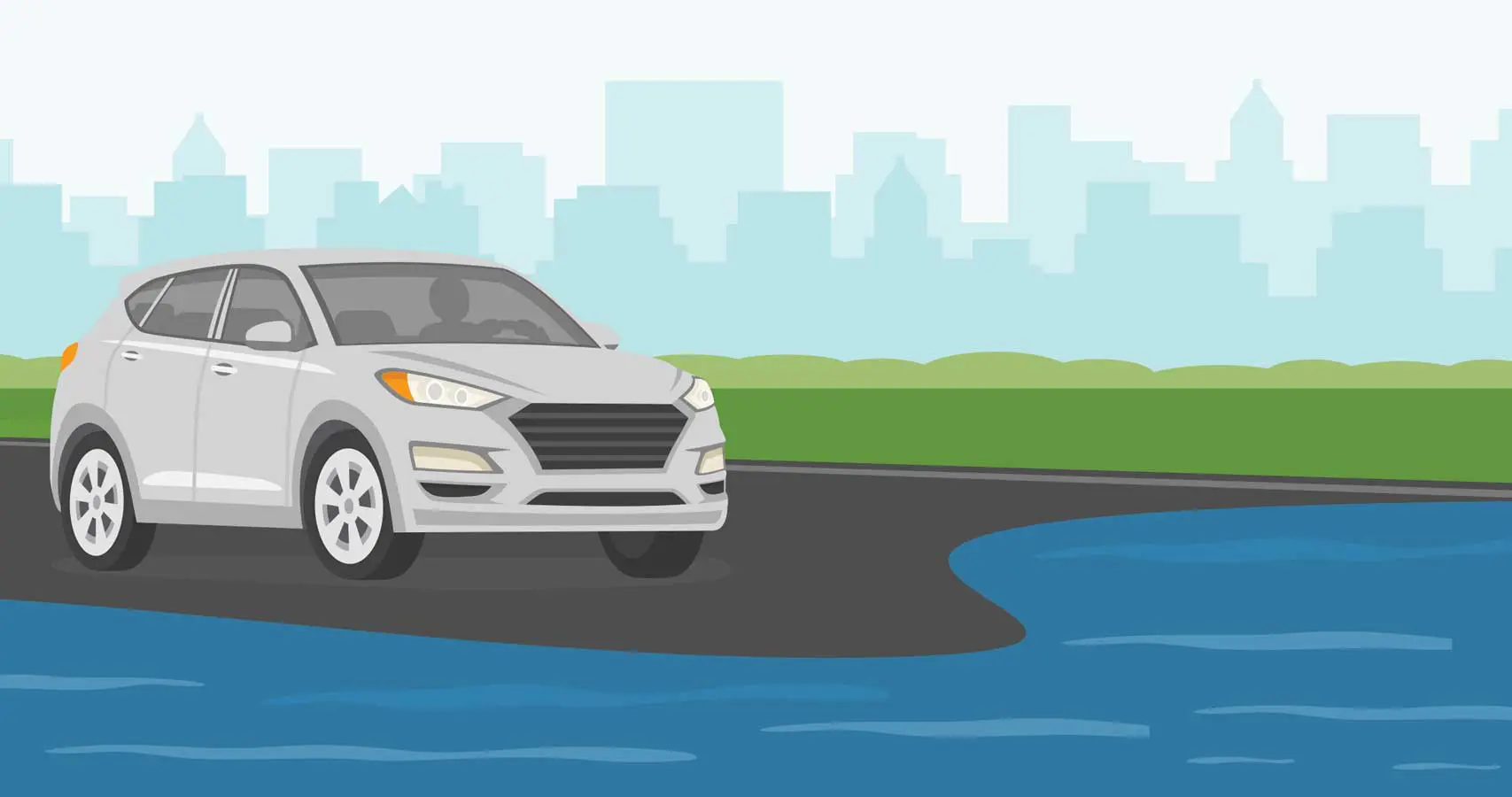 A white car driving down the road near water.
