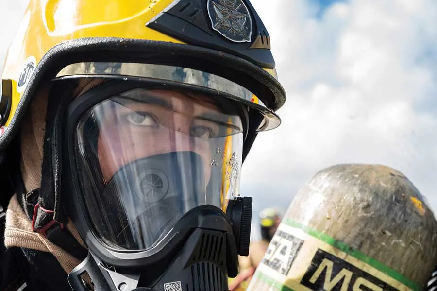 A man in a yellow and black helmet