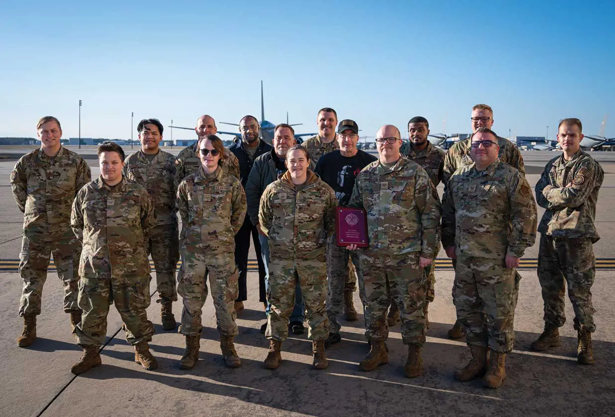 A group of people in military uniforms standing next to each other.