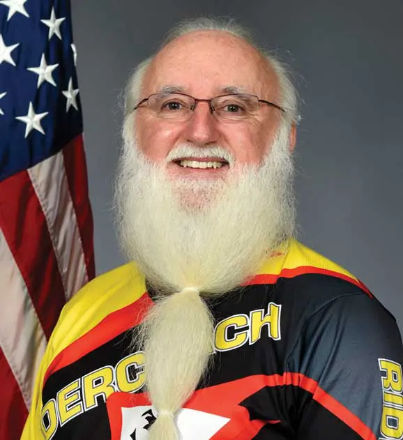 A man with long white beard and mustache.