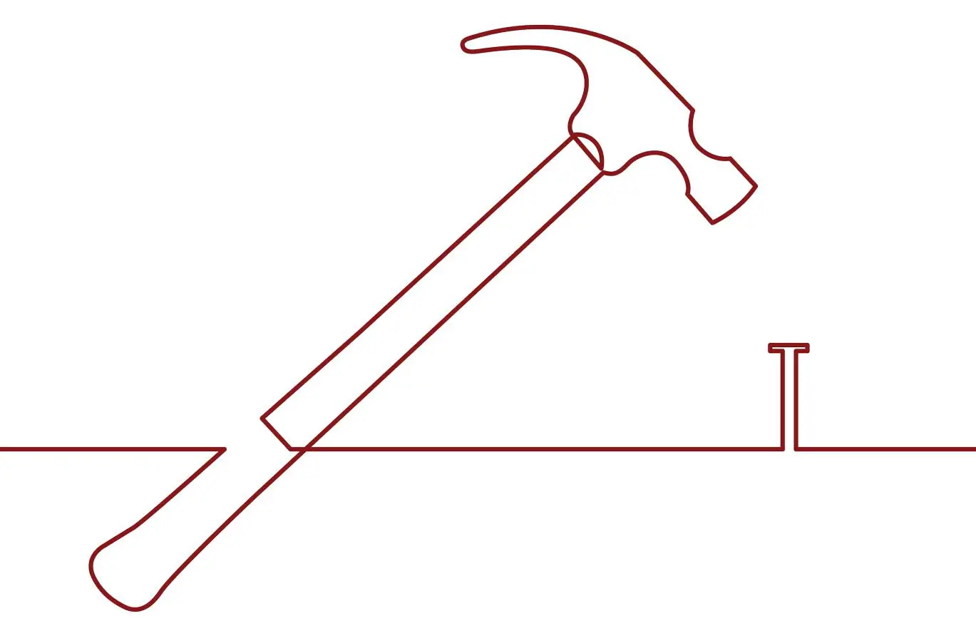 A hammer and nail are in the shape of an angle.