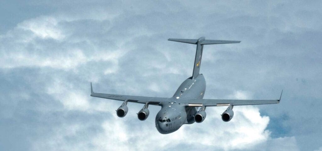 A large airplane flying through the sky