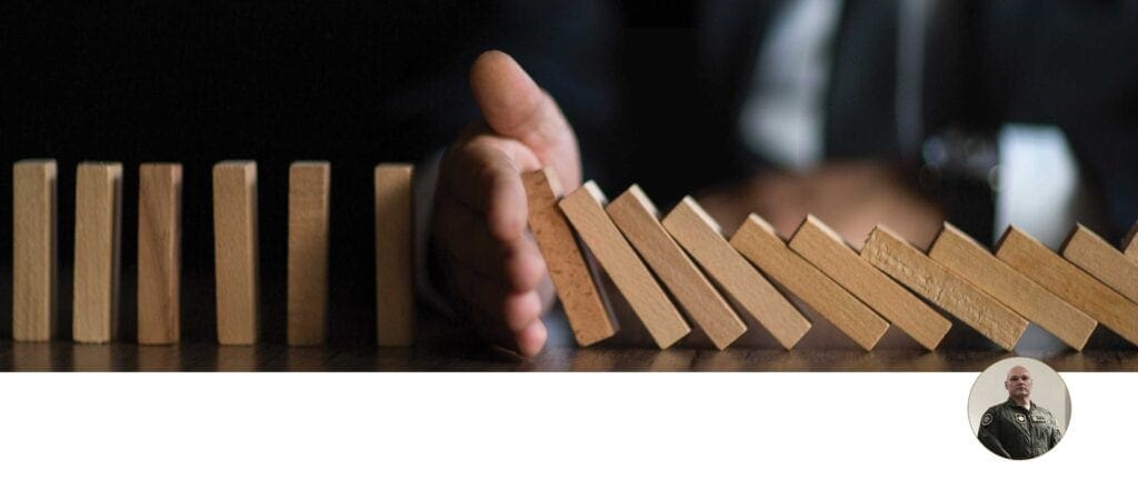 A hand is holding onto some blocks