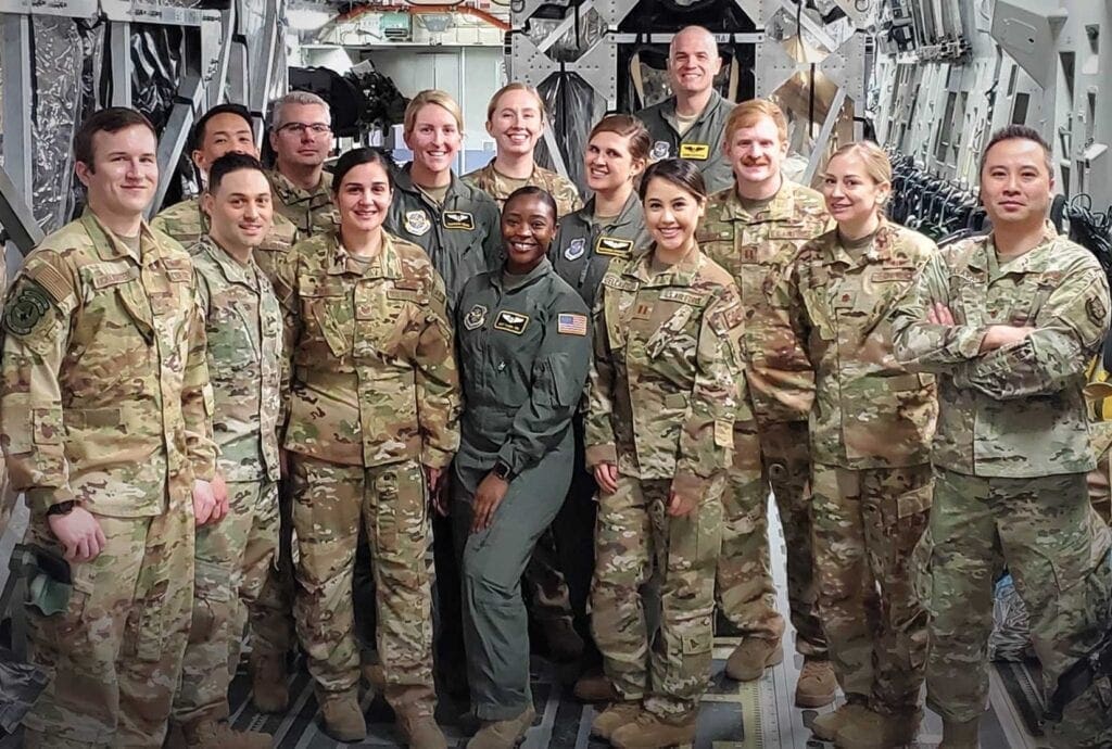 A group of people in uniform posing for a picture.