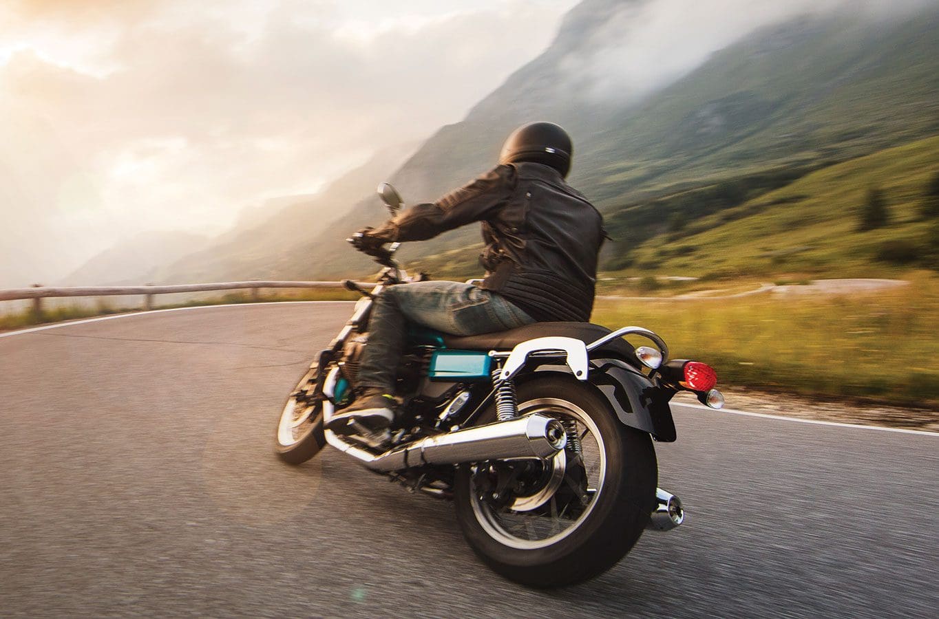 A man riding on the back of a motorcycle.