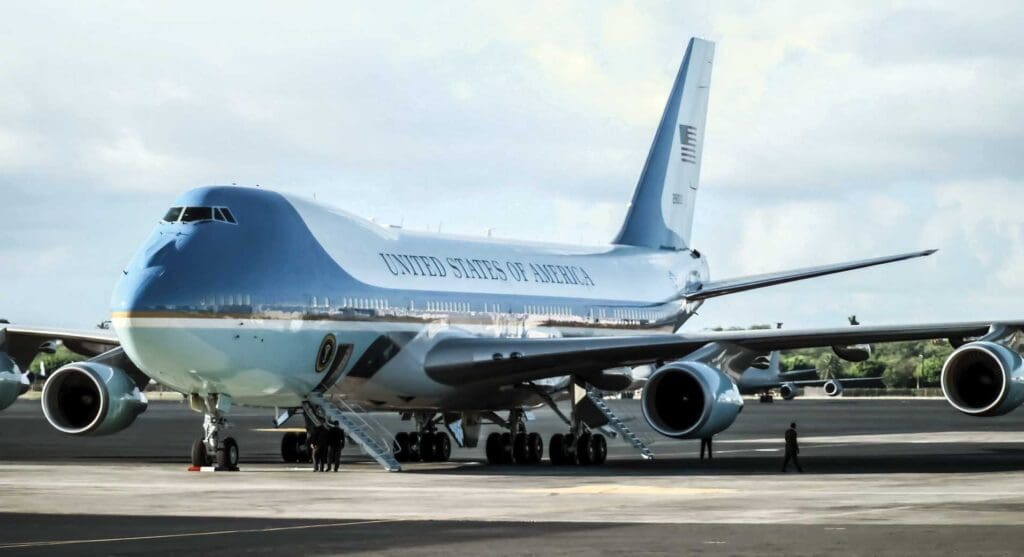 A blue air force one sitting on top of an airport runway.
