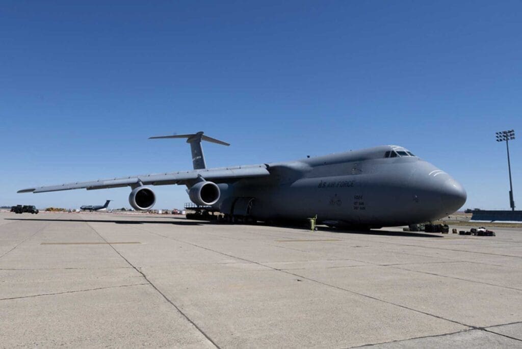 A large airplane sitting on top of an airport runway.