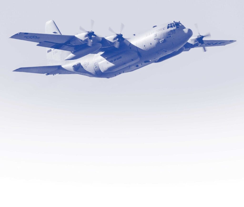 A blue airplane flying in the sky