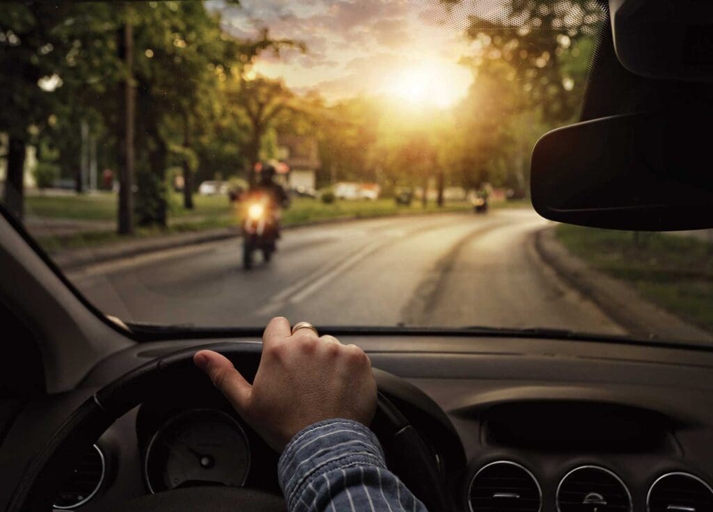 A person driving a car on the street