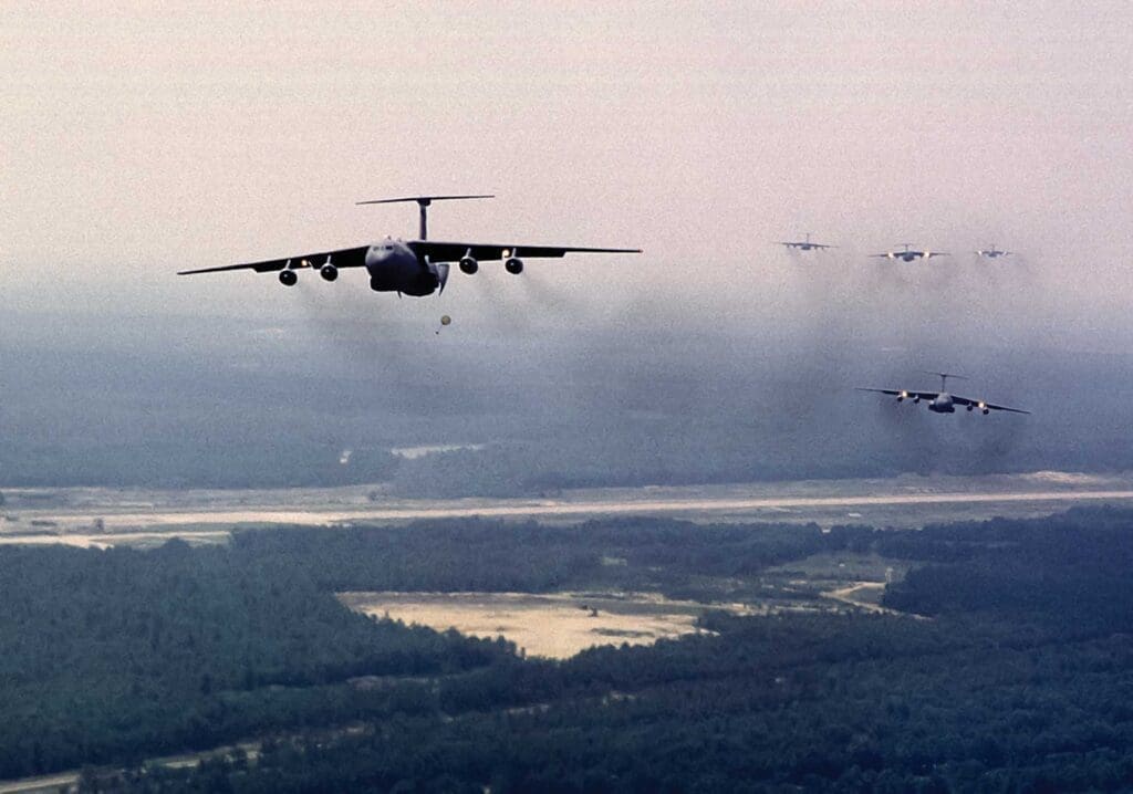 A group of planes flying in the sky.