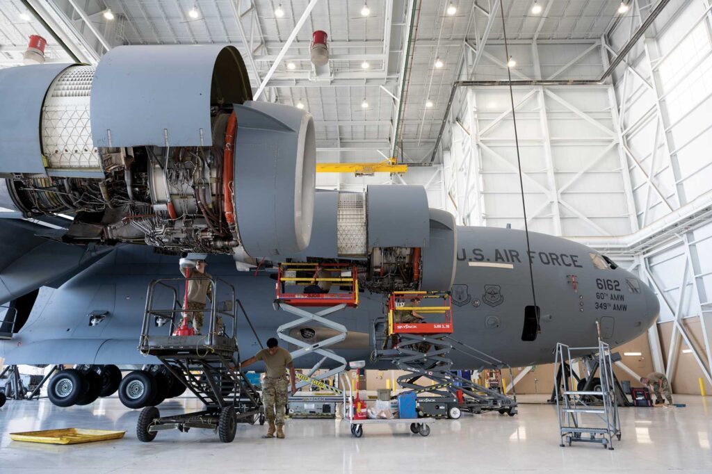 Airmen assigned to the 860th Aircraft Maintenance Squadron, Travis Air Force Base, CA, and 105th Maintenance Squadron, Stewart Air National Guard Base, NY, work together during routine maintenance on a C-17 Globemaster III July 14, 2021, at Travis AFB. USAF photo by Chustine Minoda
