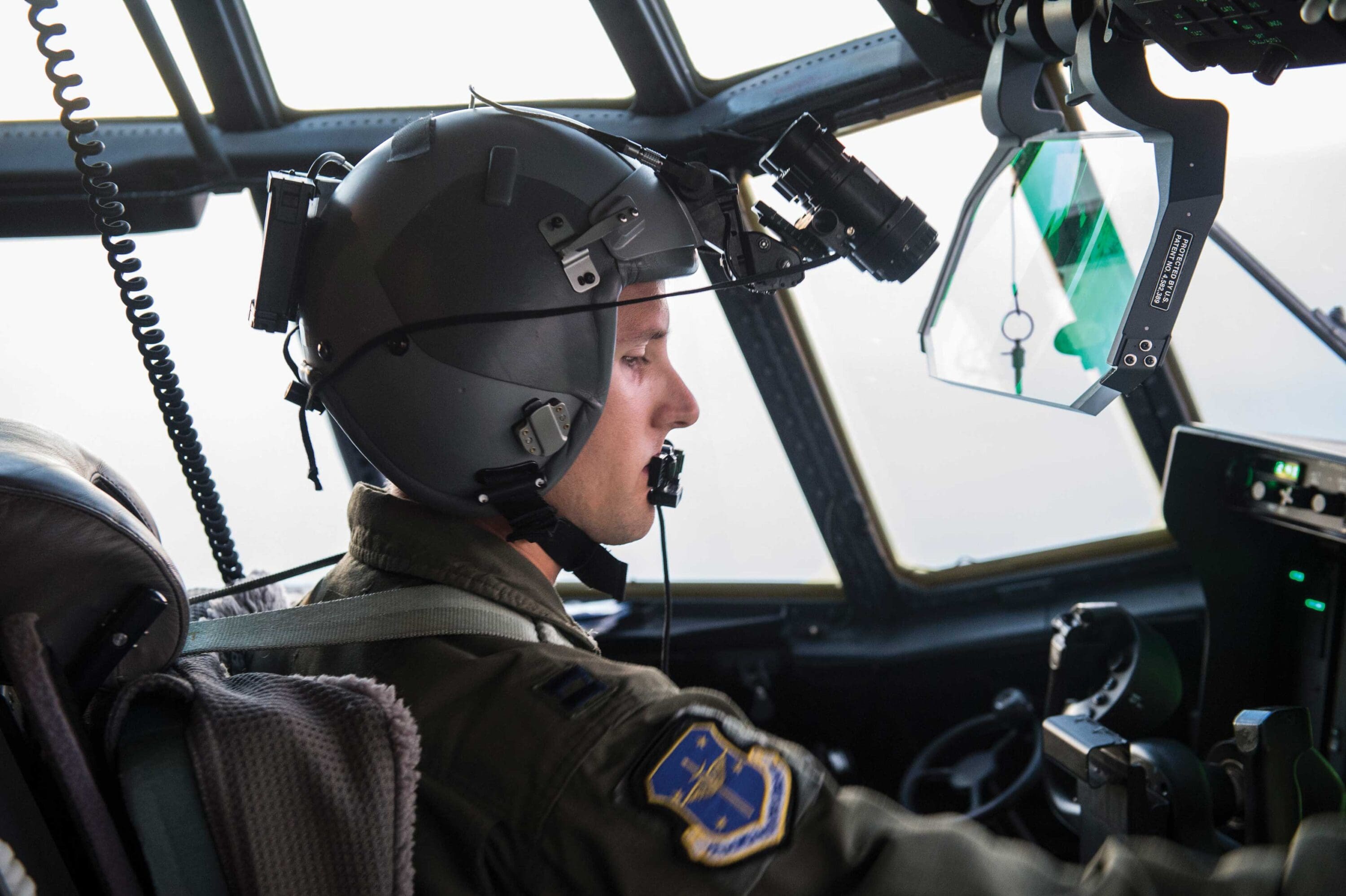A pilot in the cockpit of an airplane.