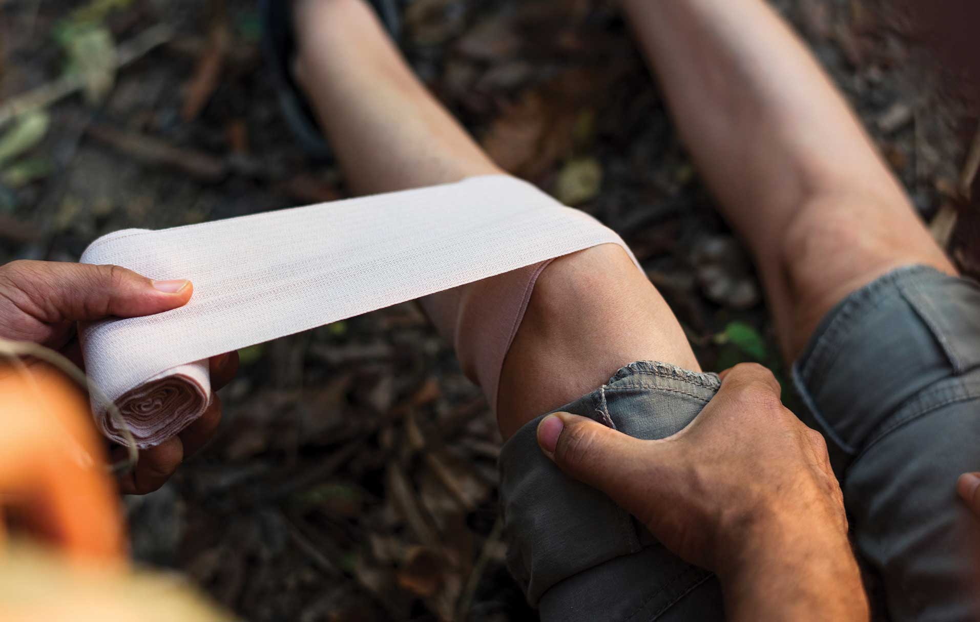 A person is holding paper in their hand.