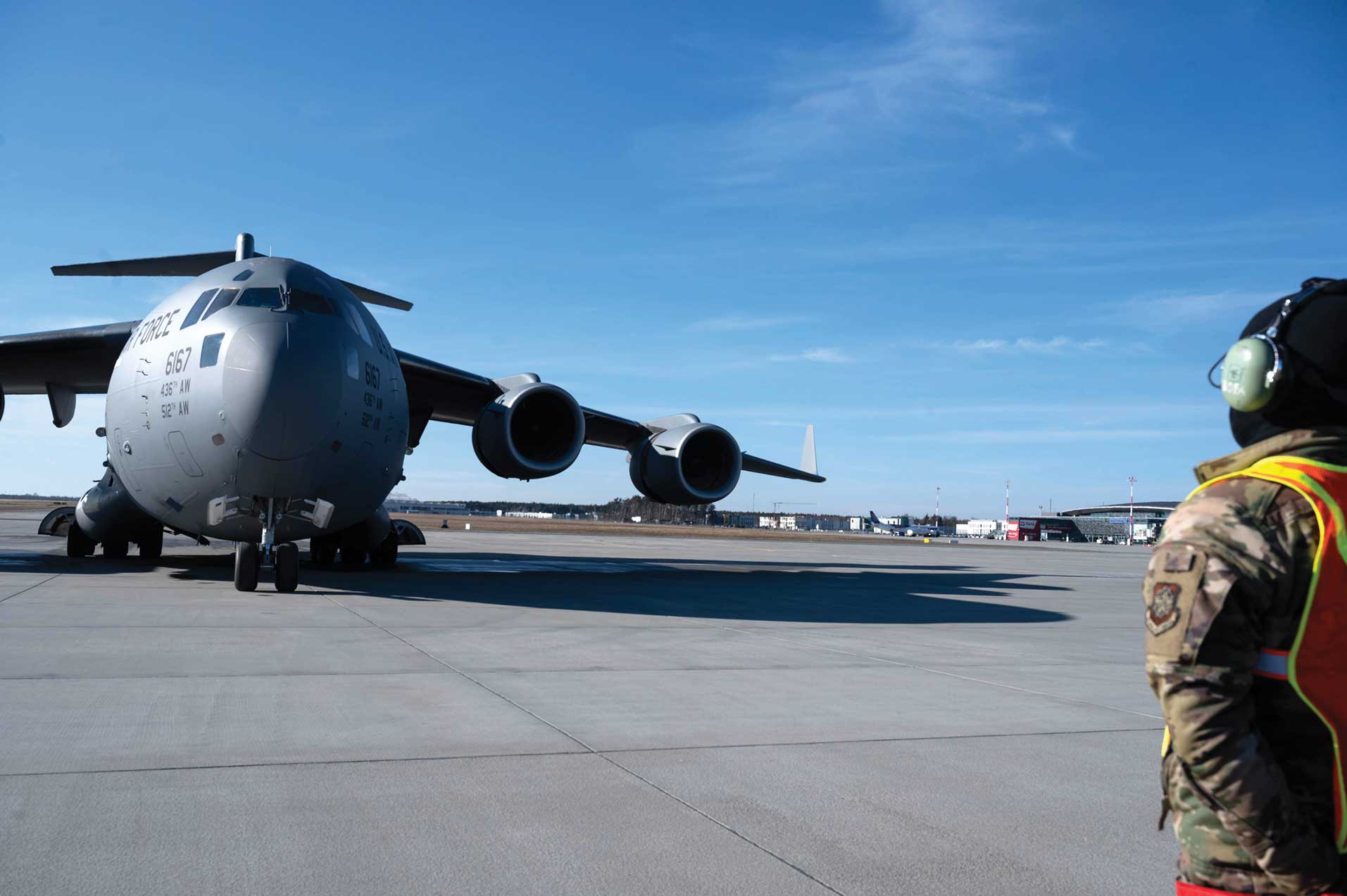 A large airplane sitting on top of an airport runway.