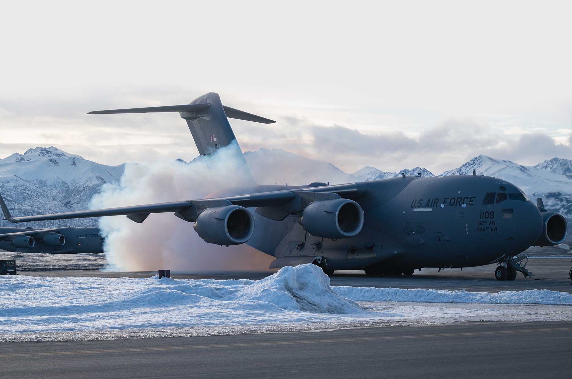 A large jet plane is on the runway.