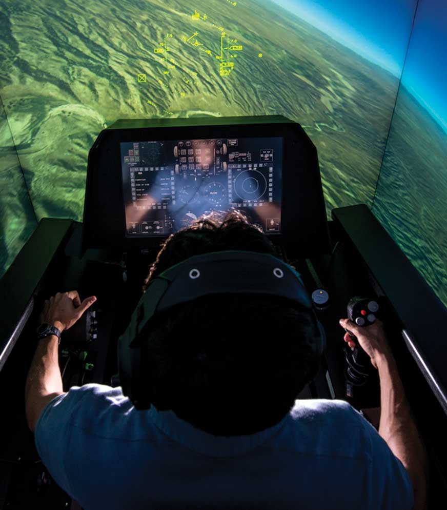 A person in the cockpit of an airplane playing a video game.