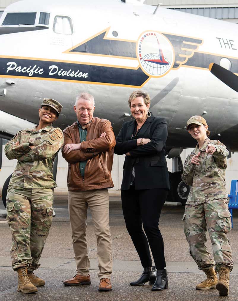 Members of the 436th Airlift Wing Occupational Safety Office pose for a photo outside the Air Mobility Command Museum at Dover Air Force Base, DE, Jan 5, 2023. From left to right: TSgt Brittany Nowell, Non-Commissioned Officer in Charge, Occupational Safety; Tim Hahn, Occupational Safety Specialist; Lorie Bellamy, Occupational Safety Manager; and TSgt Bryanna Dahl, Occupational Safety Craftsman. USAF photo by Roland Balik