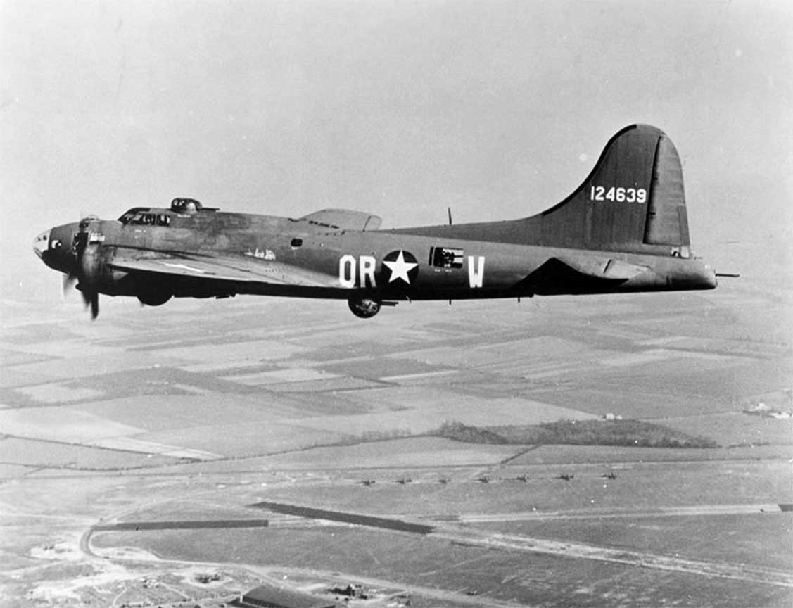 A black and white photo of an old airplane.