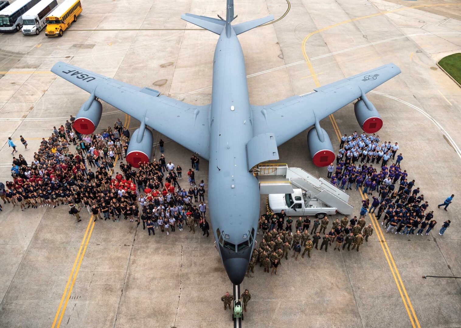 ROTC cadets, Airmen, and leadership from the 6th Air More than 700 ROTC and Junior Refueling Wing pose for a photo in front of a KC-135 Stratotanker during Military Career Day at MacDill Air Force Base, FL, April 28, 2023.