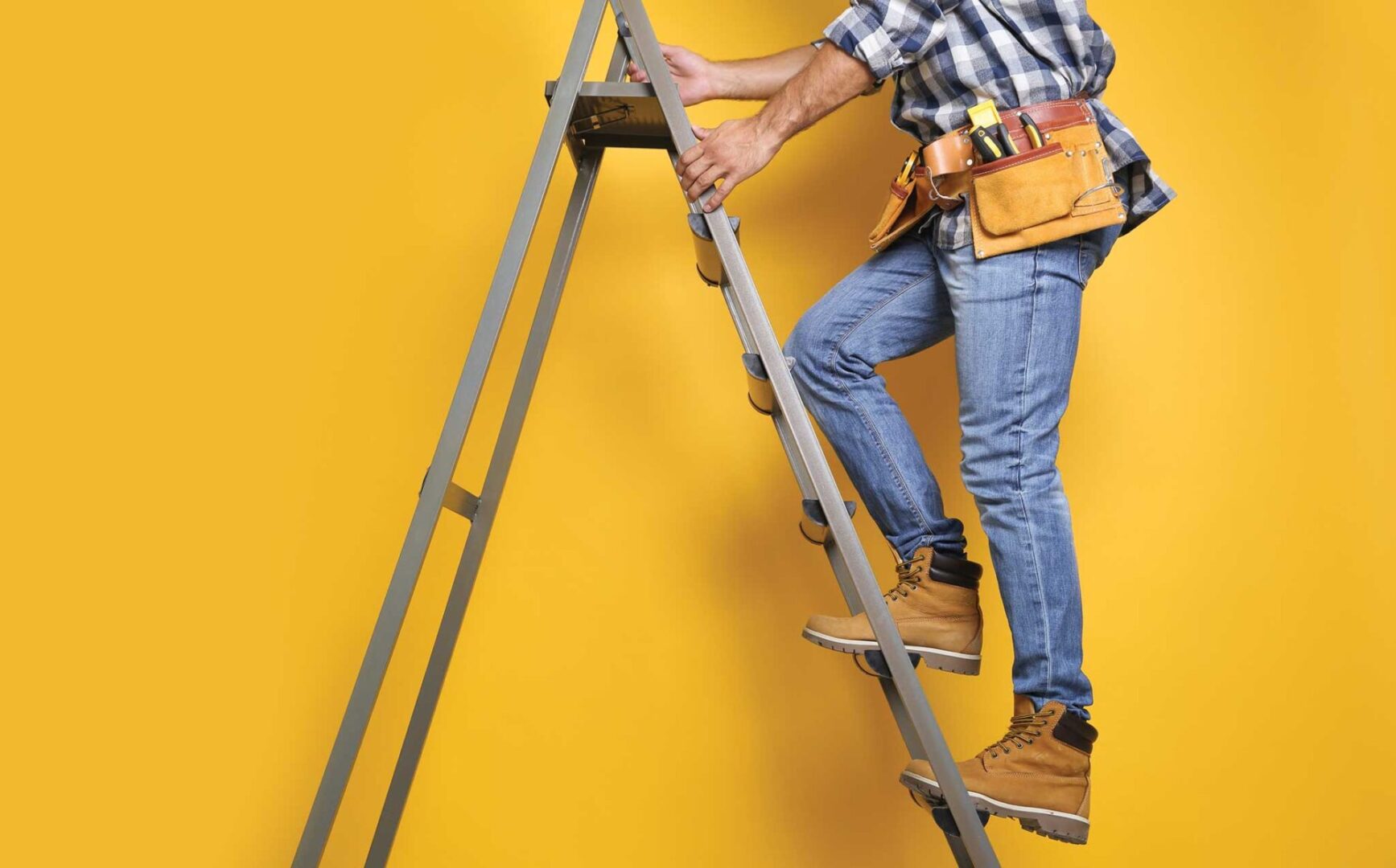 Worker climbing a ladder.
