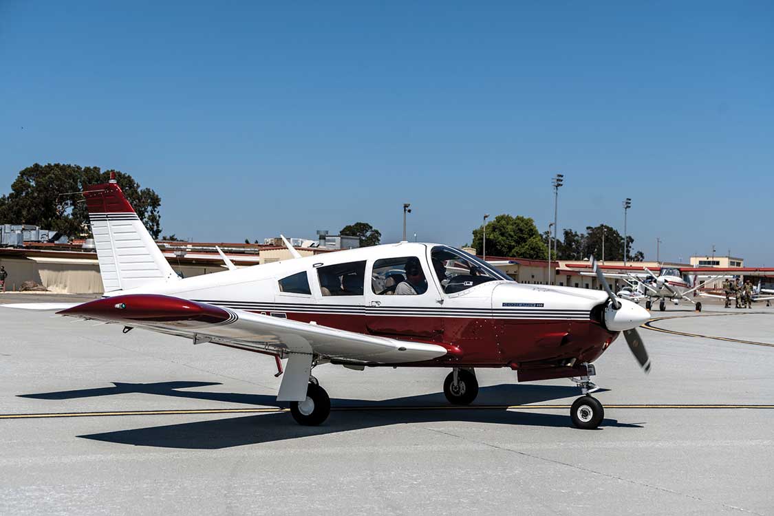 A small airplane sitting on top of an airport runway.