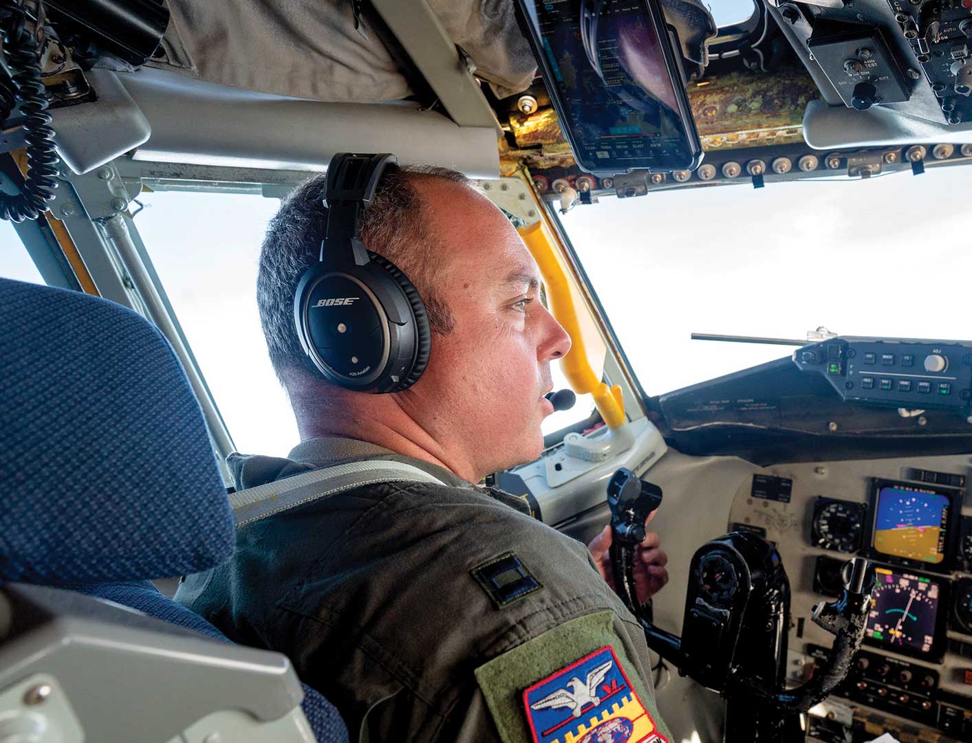 A man in the cockpit of an airplane.