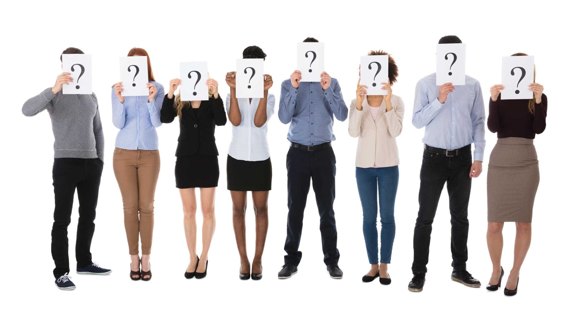 A group of people holding up signs with question marks on them.