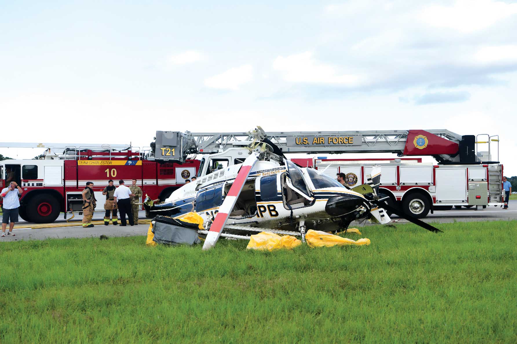 A helicopter that has been landed on the grass.